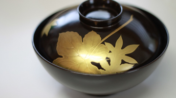 black lacquer bowl with gold decoration